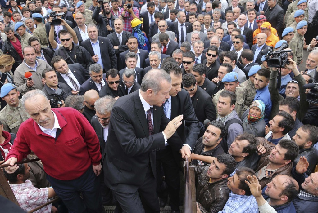 Turkey's PM Erdogan greets people as he visits the coal mine accident site in Soma