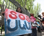Members of âSOS Sevanâ initiative stage a protest action in front of the RA NA building
