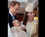 LONDON, ENGLAND - OCTOBER 23:  (EDITORS NOTE: Retransmission with alternate crop.) Prince William, Duke of Cambridge and Catherine, Duchess of Cambridge talk to Queen Elizabeth II (not pictured) as they arrive, holding their son Prince George, at Chapel Royal in St James's Palace, ahead of the christening of the three month-old Prince George of Cambridge by the Archbishop of Canterbury on October 23, 2013 in London, England. (Photo by John Stillwell - WPA Pool /Getty Images)