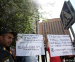 People rally in front of the Russian Embassy in Yerevan in support of the Armenian citizen Hrachya Harutyunyan who is detained after car crash near Moscow killing 18 people