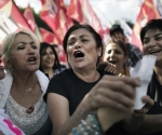 Turkish women sing as they gather at the central Kizilay square in Ankara June 8, 2013. Fresh demonstrations were also planned in the capital Ankara as the crisis entered its ninth day.AFP PHOTO/MARCO LONGARI        (Photo credit should read MARCO LONGARI/AFP/Getty Images)